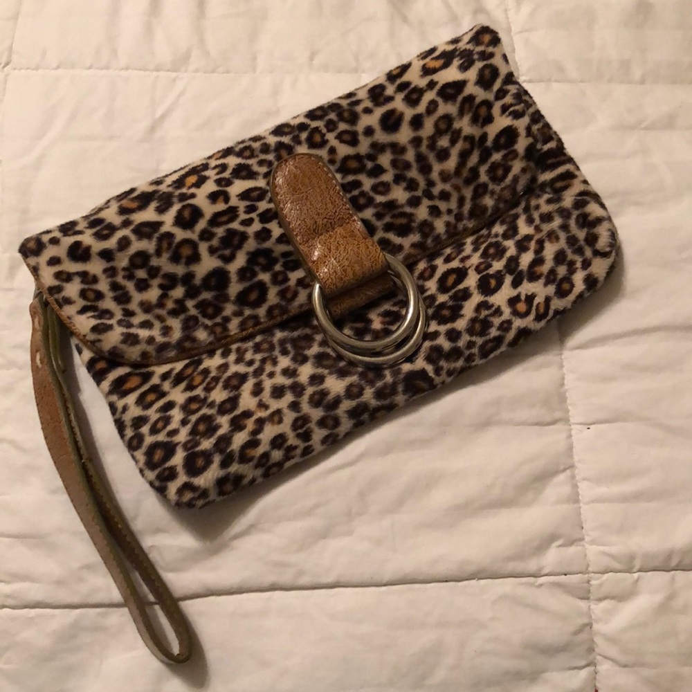 FIRM! Leopard faux fur clutch 🐆